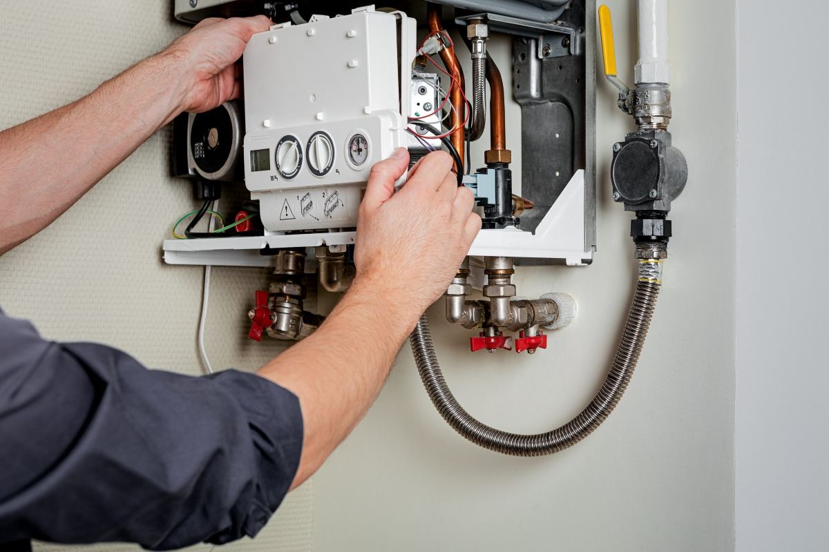 Engineer servicing a commercial boiler